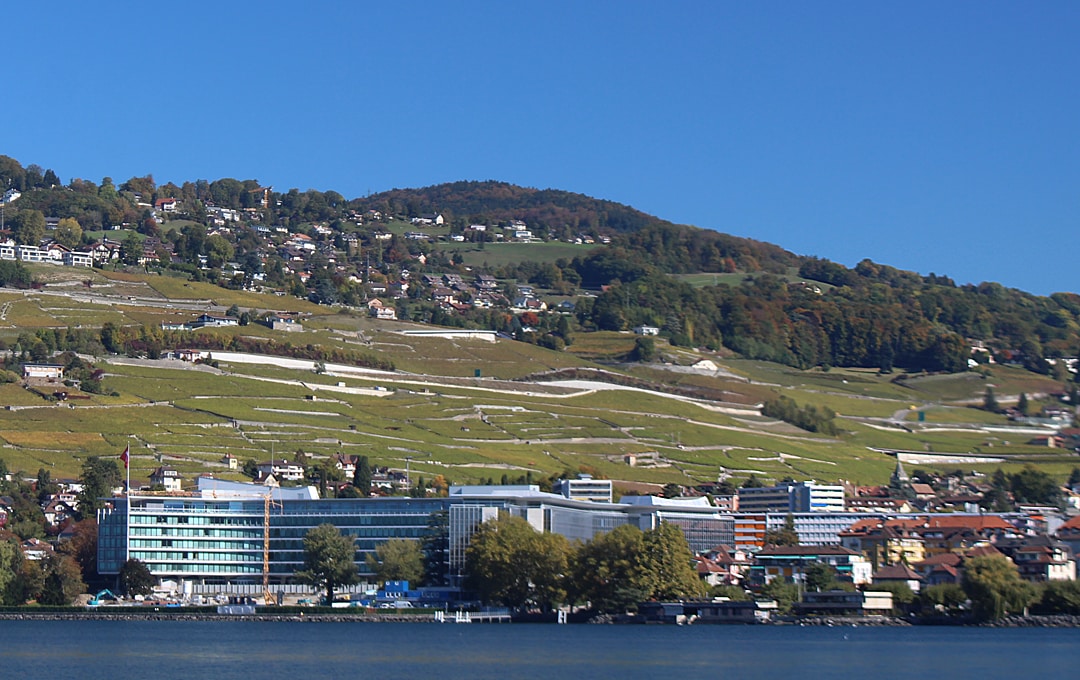 Food giant:  Beneath the vineyards, Nestlé’s headquarters, Vevey on Lac Léman, Switzerland | Peter Ungphakorn CC SA-BY 4.0